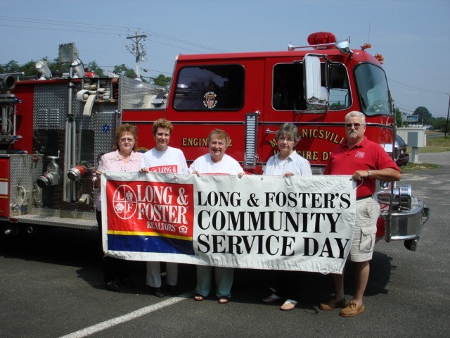 Station 22 Vice President Dave Sampson with E-222 at the Long & Foster Community Servcie Day